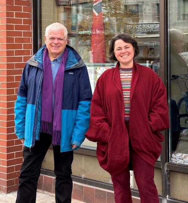 M-P-P Peter Tabuns and midwife Simone Rosenberg stand together outside an office building.