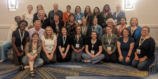 Group photo of head midwives gathered at the Head Midwives Carousel in May 2024.