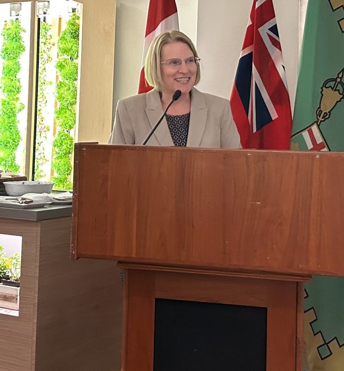 Deputy Premier and Health Minister Sylvia Jones delivers a speech at a podium. 